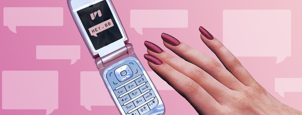 hand reaching for vintage cell phone