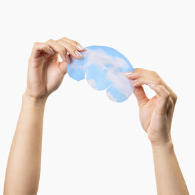 Hands holding a Lazies mask