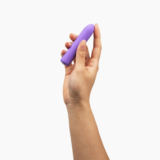 purple zip vibrator in hand