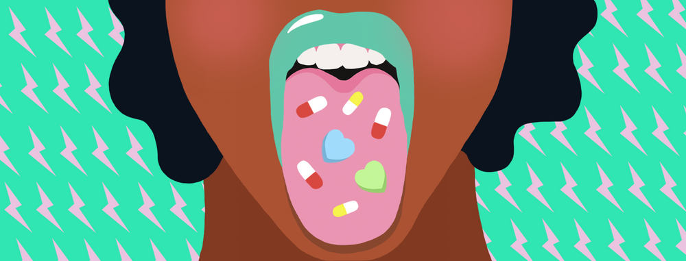Woman sticking out tongue with pills 