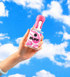 Hand holding bottle of Buff