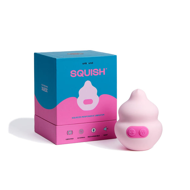 pink squish vibrator in front of packaging
