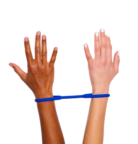 Hands wearing navy blue silicone handcuffs