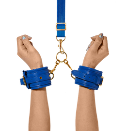 Hands modeling the Orion handcuffs